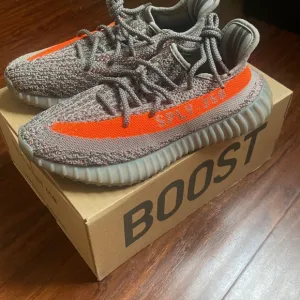 Adidas Gray and Orange Athletic Shoes with Boost Cushioning