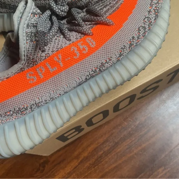 Adidas Gray and Orange Athletic Shoes with Boost Cushioning