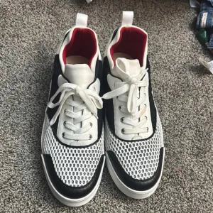 Christian Louboutin Black and White Sneakers with Modern Design