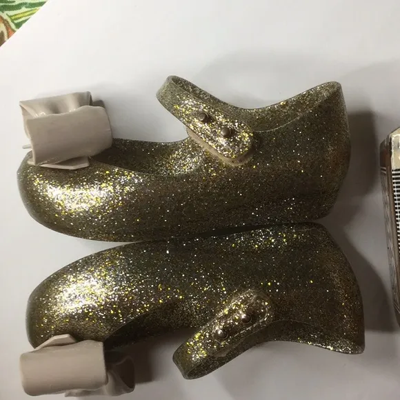 Mini Melissa gold glitter Ultragirl bow jelly flat