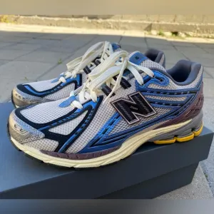 New Balance Blue and White Athletic Shoes with Mesh Upper