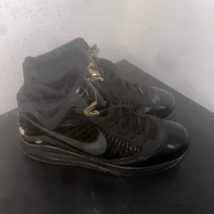 Nike Black and Gold Athletic High-Top Shoes