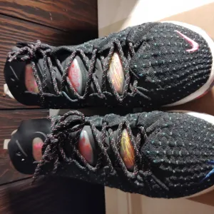 Nike Black and Pink Athletic Shoes with Textured Knit Design