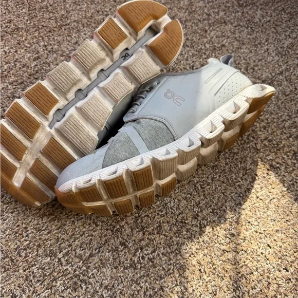 On Running Gray Athletic Shoes with Modern Design and Unique Sole